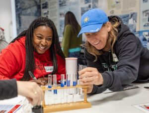 Two teachers working with test tubes.
